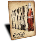 PLACA COCA-COLA BOTELLAS